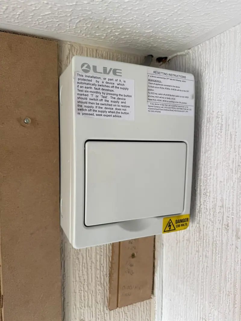 The new consumer unit fitted in the same spot on the same job, closed up and labelled