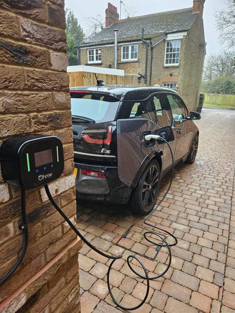 Home EV charge point installed on an exterior wall